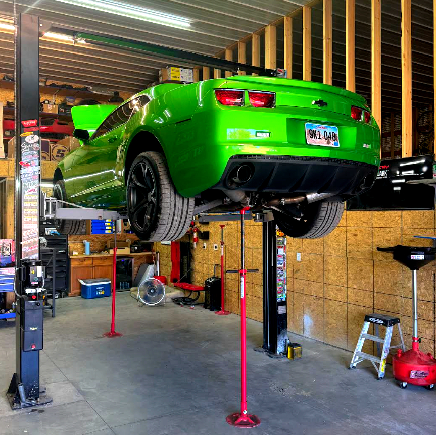 Chevrolet Camaro SS raised on a two post lift inside the Maupin Metalworks shop